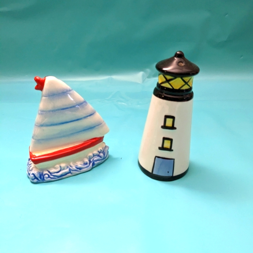 Vintage FIGI salt and pepper shaker. Lighthouse and sail boat. Colorful.